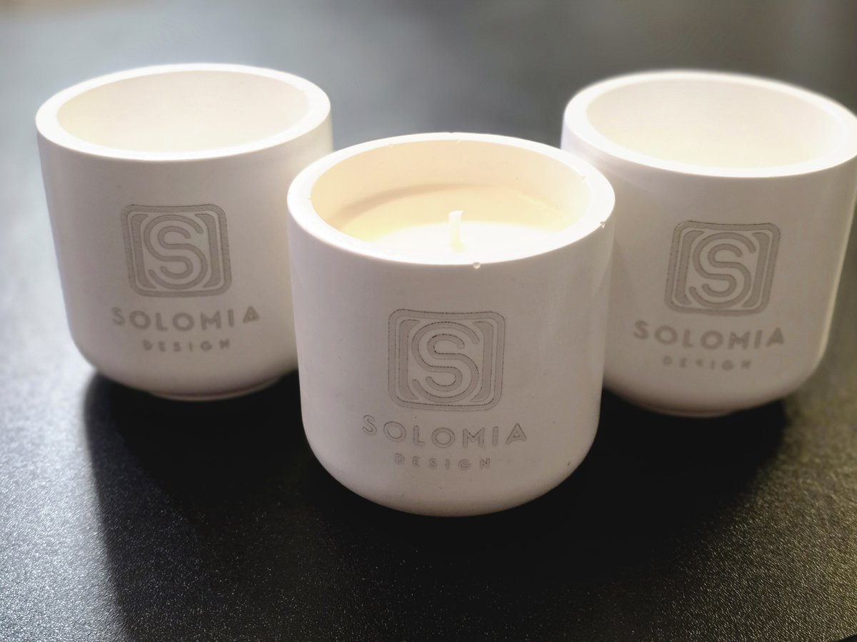 Handmade candle vessels with an engraved Solomia Design logo